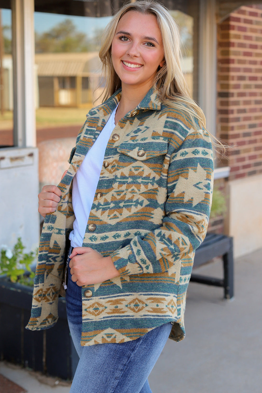 Aztec print shacket in dusty blue with button front and patch pockets.