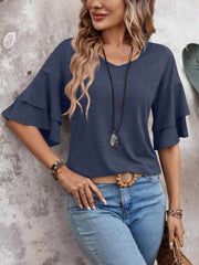Indigo tiered sleeve jersey tee with V-neck and relaxed fit.