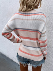 Pastel stripe crewneck knit sweater with peach, beige, white, and blue stripes.