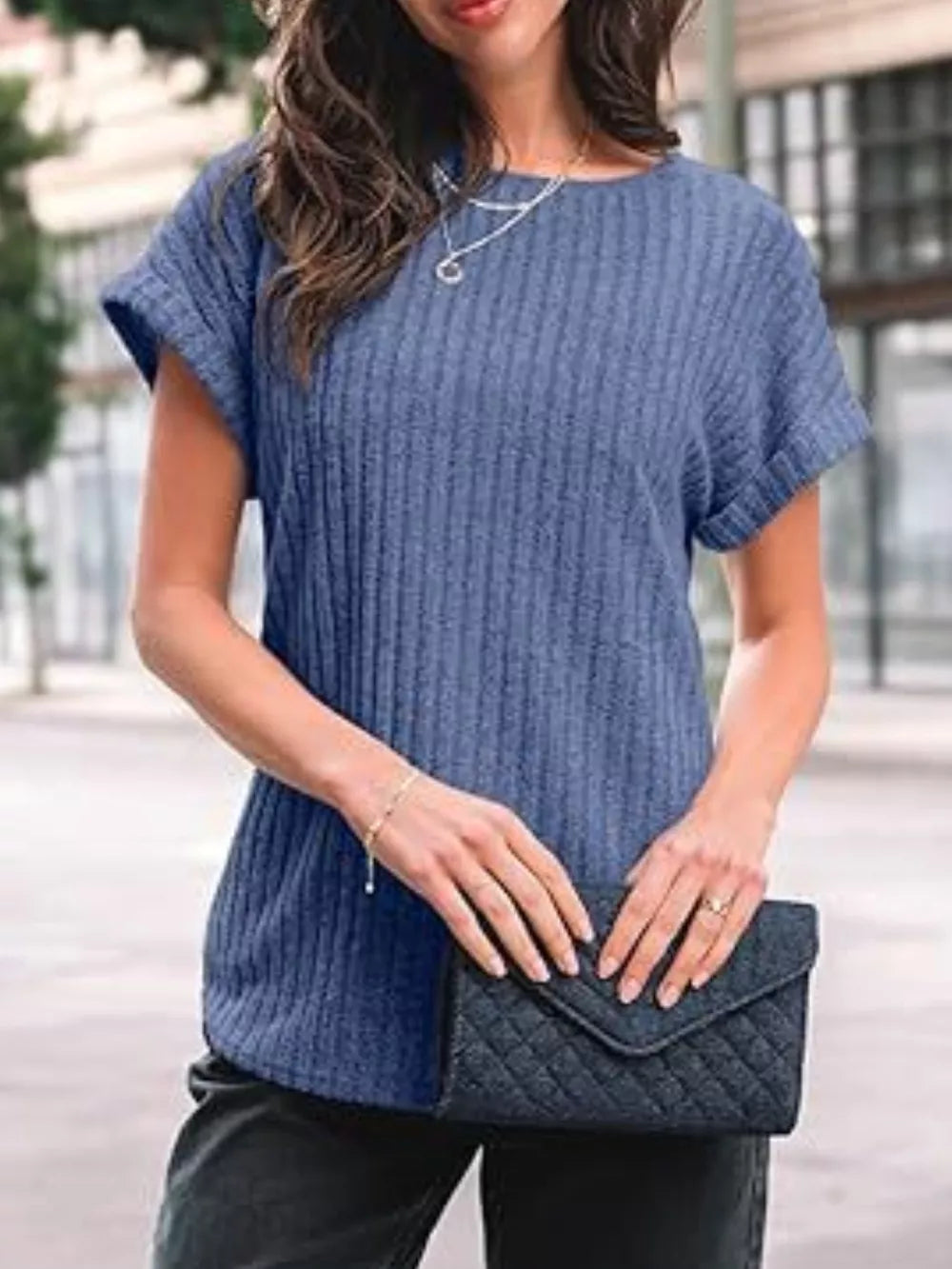 Ribbed knit t-shirt in light blue with cuffed short sleeves and a crew neck.