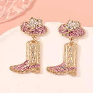 Rhinestone cowboy boot dangle earrings with pink and white crystals.