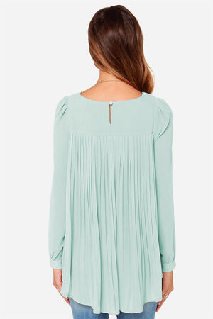 Light green long sleeve blouse with pleated back and button closure.