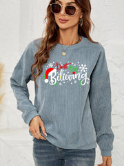 Misty Blue corduroy crewneck sweatshirt with a Christmas graphic that says "Don't Stop Believing.