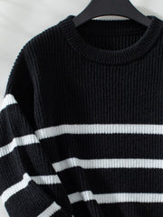 Black ribbed knit sweater with white horizontal stripes and crew neck.