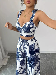 Blue and white tropical print crop top and wide-leg pants set with tie straps.