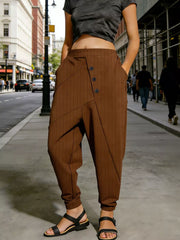 Caramel pinstripe harem pants with decorative buttons and pockets, cuffed ankles.
