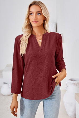 Burgundy textured henley shirt with V-neck and roll-tab sleeves