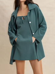 Textured mini dress and duster set in French Blue with tie-neck detail and button closure.