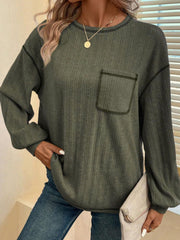 Moss ribbed knit sweater with contrast stitch pocket and crew neck.