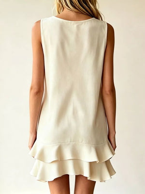 Tiered ruffle mini dress in Lotus Color with a scoop neckline and sleeveless design.