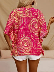 Bohemian print V-neck t-shirt in hot pink with short sleeves and a relaxed fit.