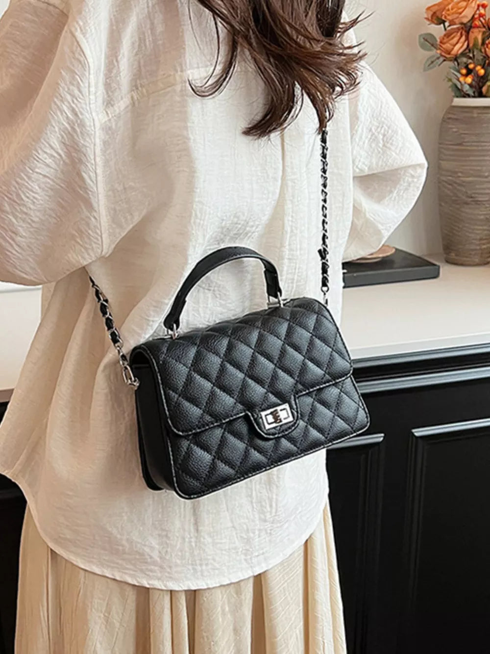 Quilted Chain Strap Crossbody Bag in Black, close-up detail
