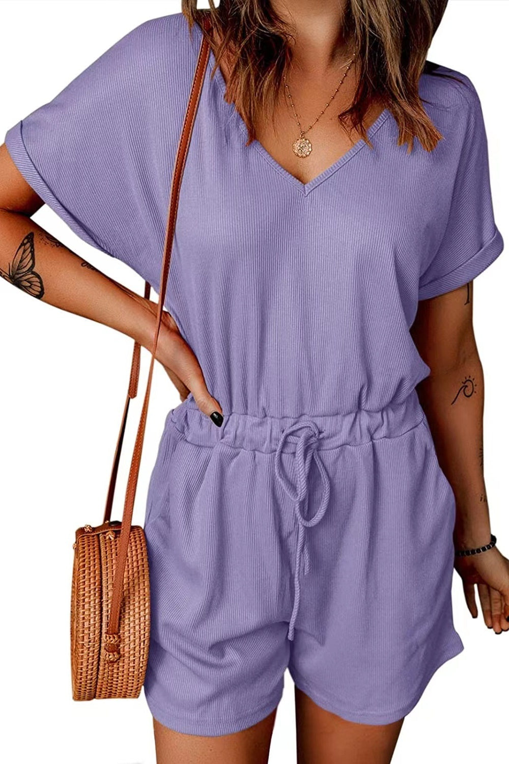Lavender ribbed V-neck romper with cuffed short sleeves and drawstring waist