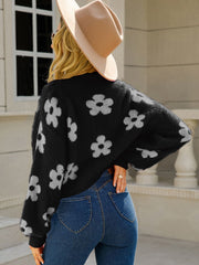 Black acrylic floral puff sleeve open cardigan with a fuzzy texture.