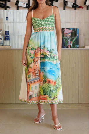 Gingham bodice midi dress with scenic coastal print and decorative trim.