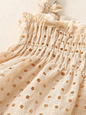 Apricot cotton eyelet tank top with ruffled straps and smocked bodice.