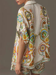 Bohemian print linen two-piece set with buttoned shirt and high-waisted shorts.