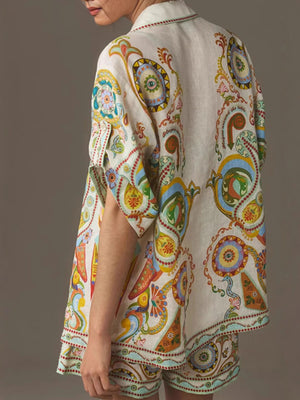 Bohemian print linen two-piece set with buttoned shirt and high-waisted shorts.