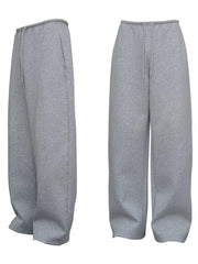 Relaxed-fit lounge trousers in dark gray with a drawstring waist and wide leg.