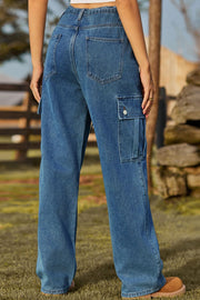 Medium wash denim cargo pants with flap pocket detail.