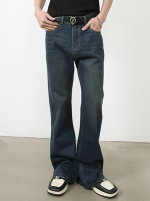 Dark flared denim jeans with subtle fading and bootcut leg