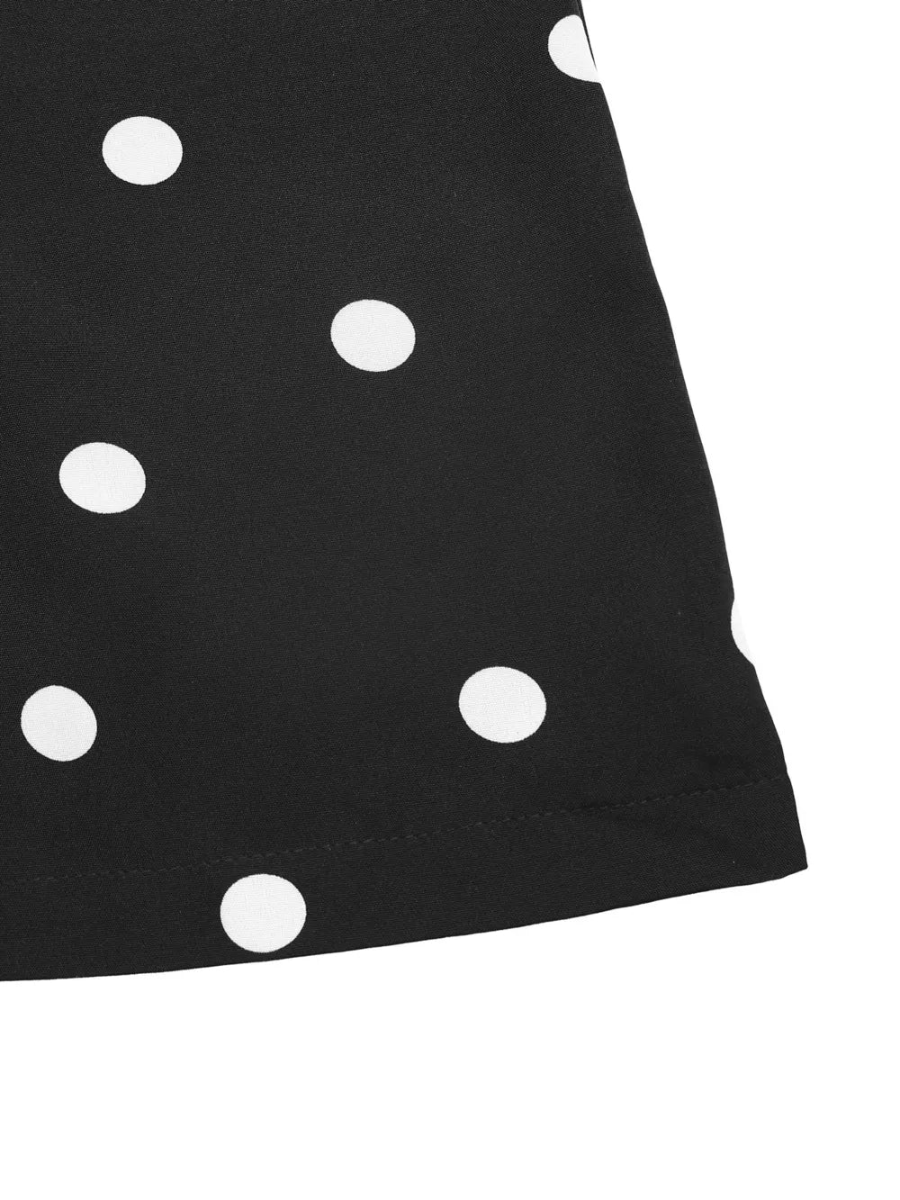 Black polka dot jumpsuit with wide legs and a strapless neckline.