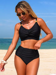 Black twisted front bikini set with high-waisted bottoms and gold strap details.
