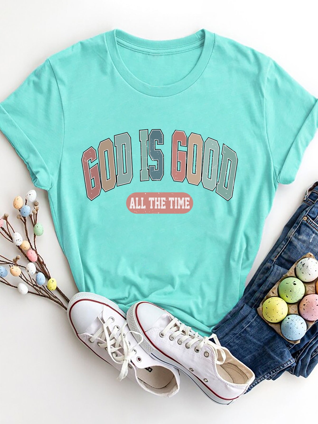 Aqua graphic crewneck t-shirt with "GOD IS GOOD ALL THE TIME" text.