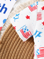 Patriotic baby shirt with American flag and star print, short sleeves, white cotton.