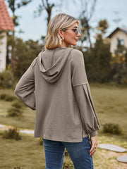 Mocha ribbed hoodie with balloon sleeves and a hood, shown from the back.