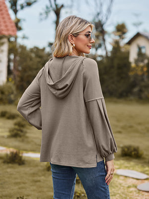 Mocha ribbed hoodie with balloon sleeves and a hood, shown from the back.