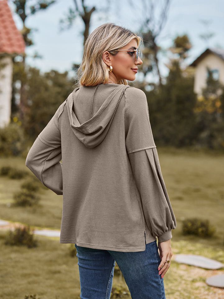 Mocha ribbed hoodie with balloon sleeves and a hood, shown from the back.