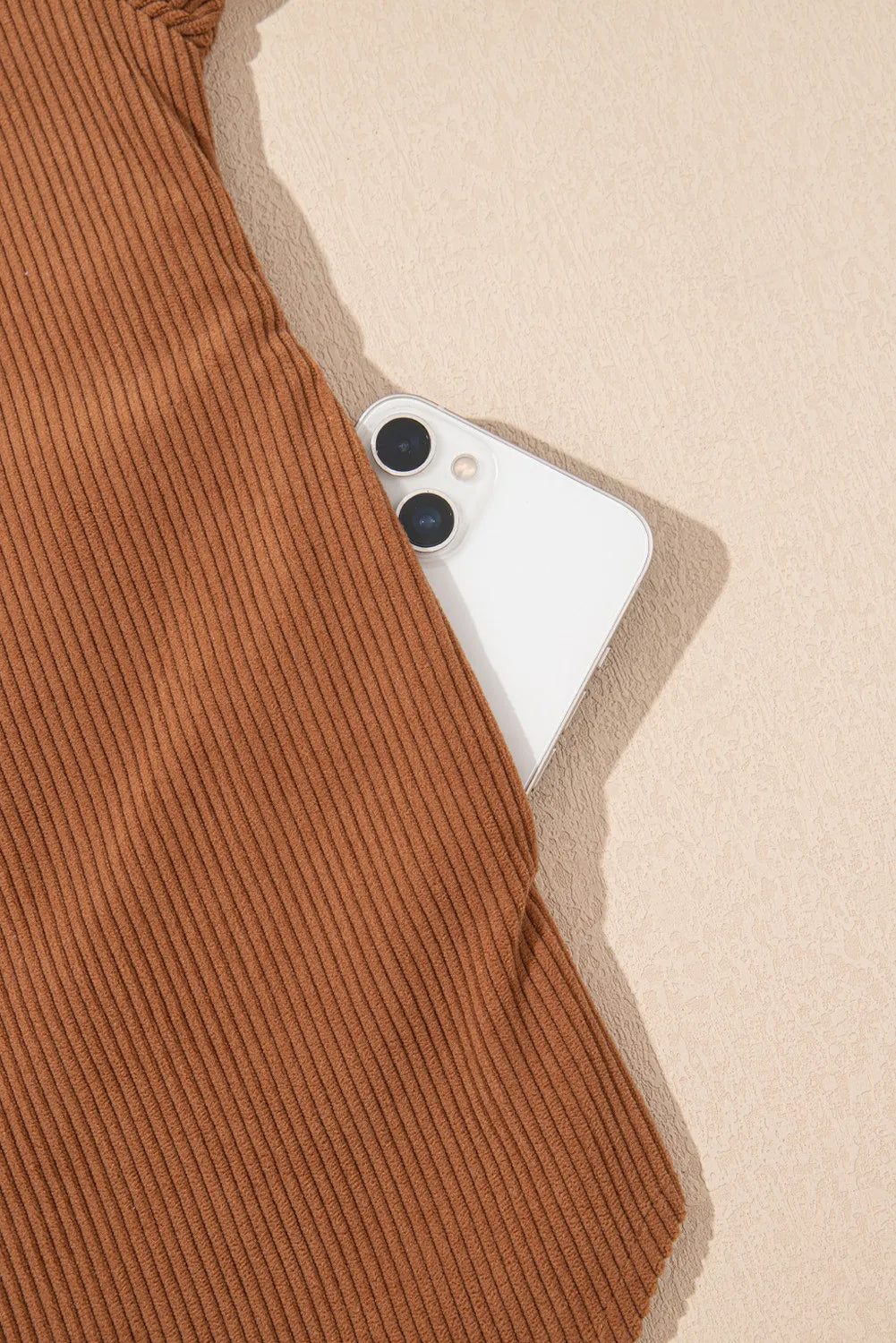 Caramel corduroy shirting jacket with gathered sleeves and a hidden phone pocket.