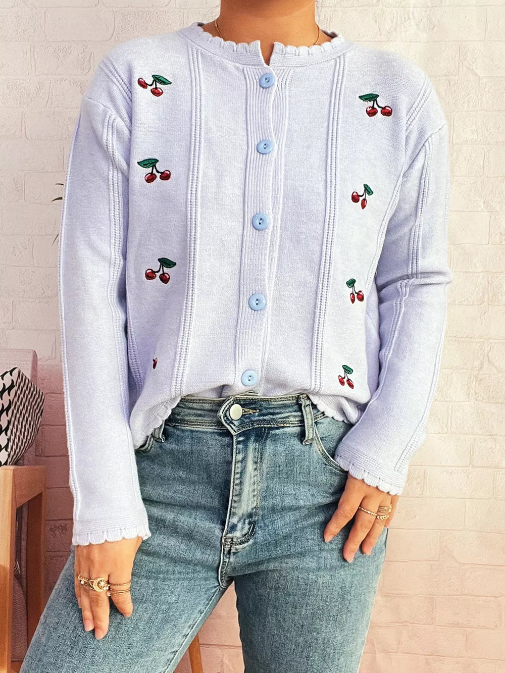 Light blue button up cardigan with cherry embroidery and scalloped trim.