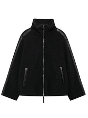 Black teddy fleece zip-up jacket with contrast piping and faux leather trim.