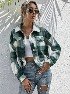 Cropped green plaid shacket with patch pockets and button front.