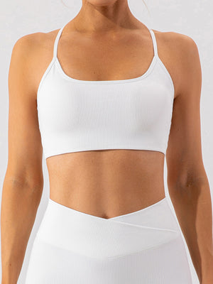 White ribbed halterneck active bra with thin straps and square neckline.