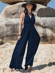 Dark blue halter neck wide leg jumpsuit with tie waist detail