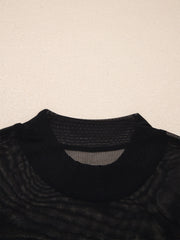 Black sheer mesh t-shirt with cap sleeves and mock neck detail.