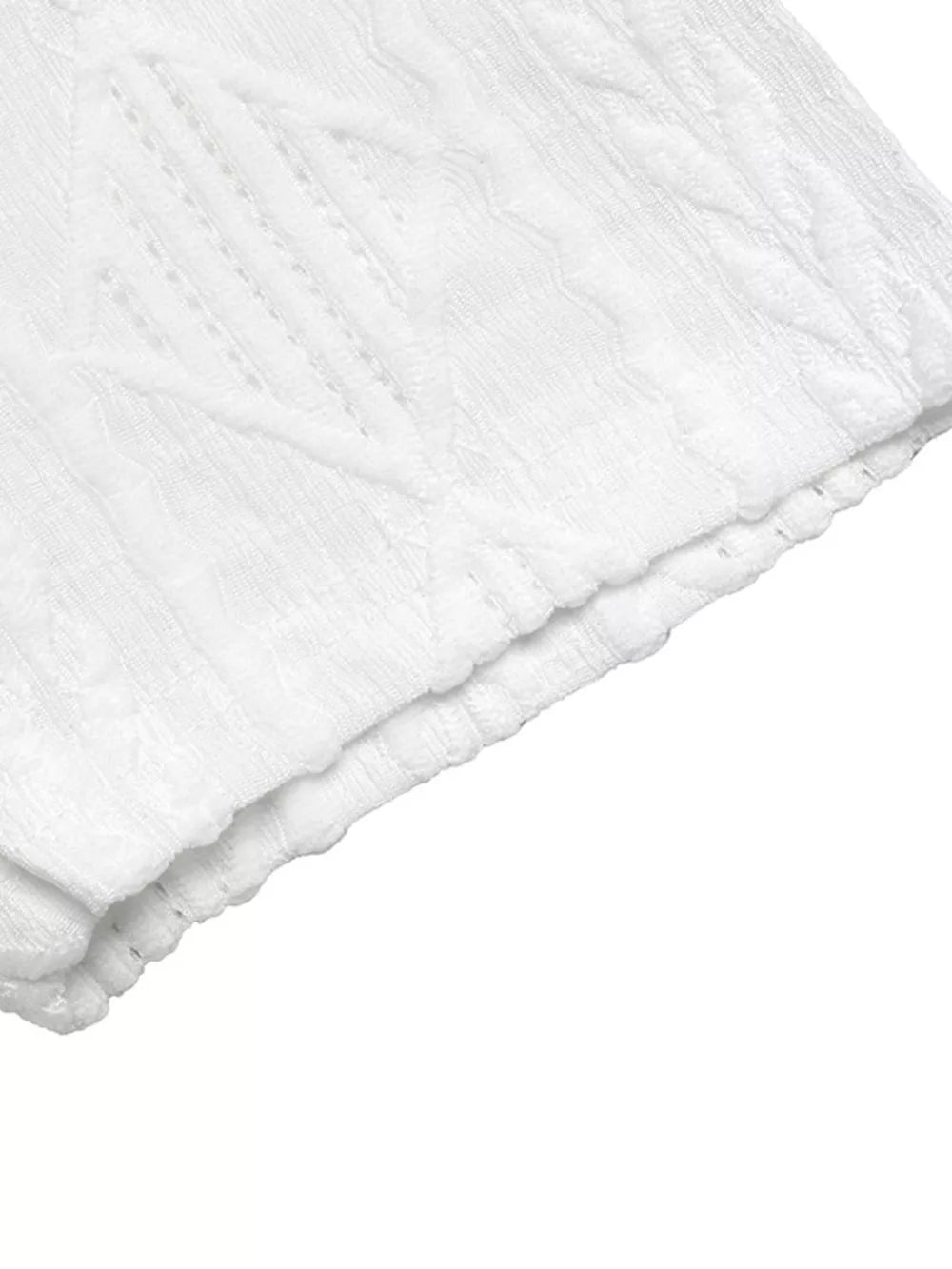 White textured knit maternity t-shirt with subtle diamond pattern and bow detail.