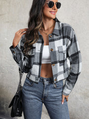 Checked plaid shacket in dark gray with patch pockets and button front.