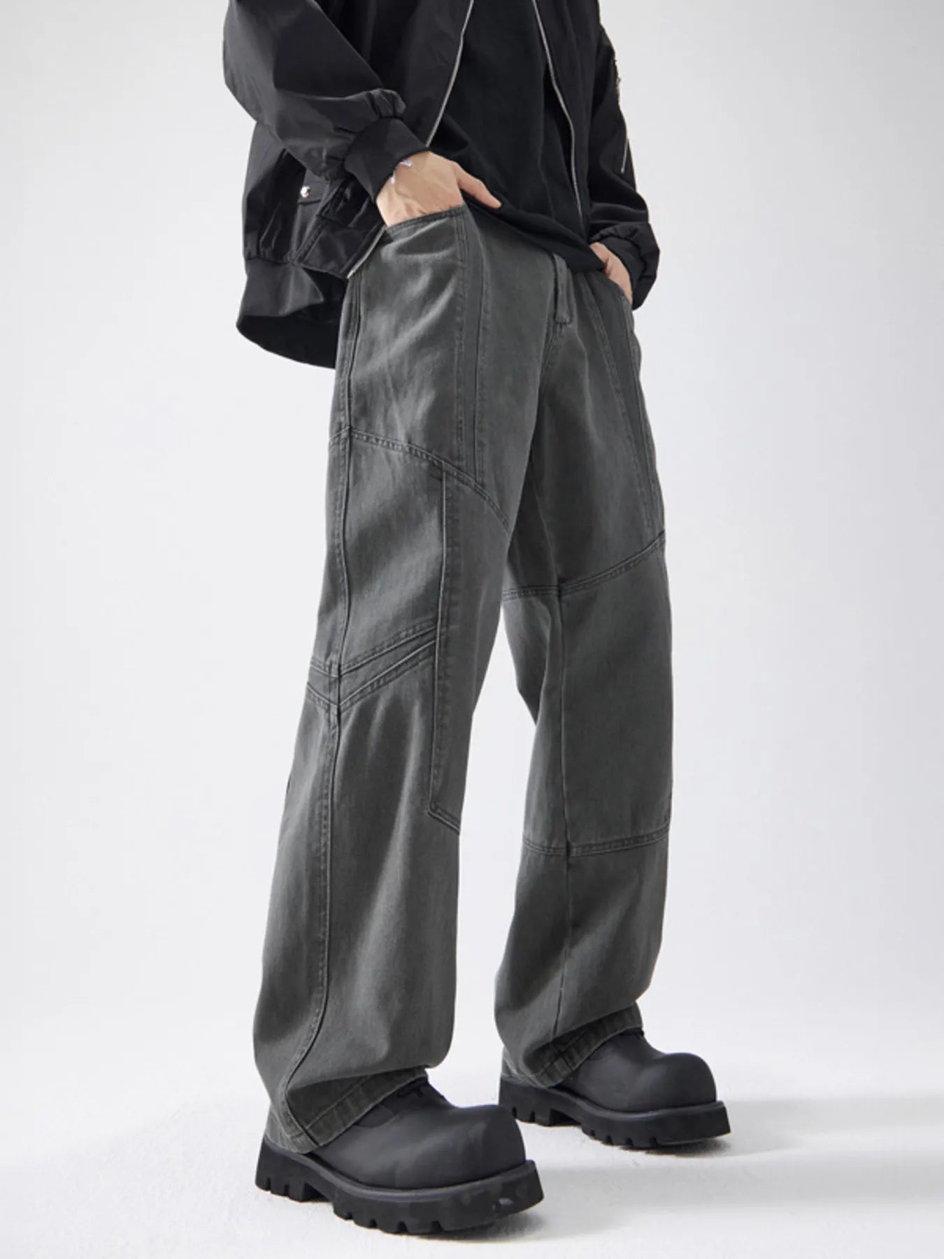 Gray cotton wide-leg trousers with paneling detail and a relaxed fit.
