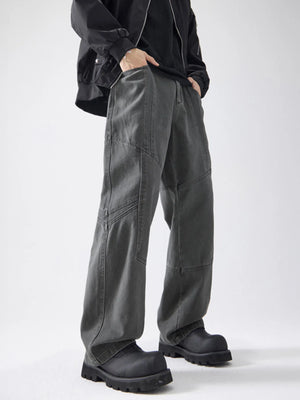 Gray cotton wide-leg trousers with paneling detail and a relaxed fit.