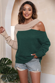 Asymmetric shoulder block sweater in dark green and tan acrylic with boat neck.