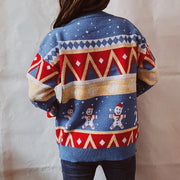 Festive Fair Isle knit jumper in blue with gingerbread men and geometric pattern.