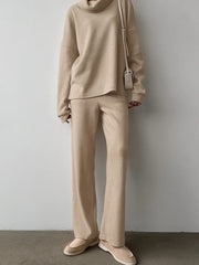 Beige cowl-neck turtleneck and wide-leg pants set with a relaxed fit.