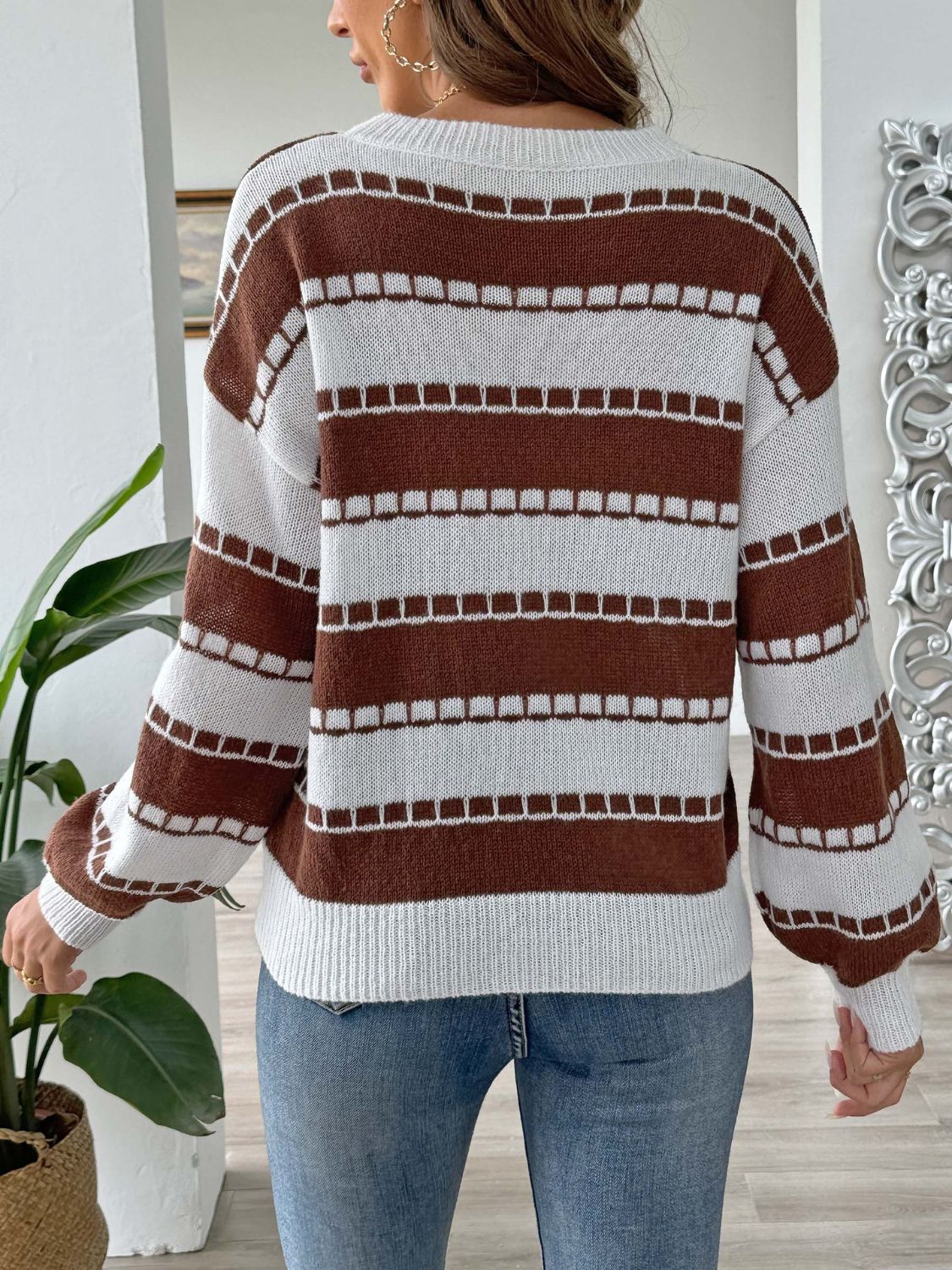 Brown and white striped knit sweater with balloon sleeves and square detail embroidery.