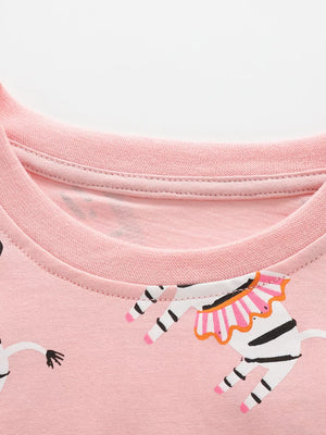 Pink cotton blend toddler top with circus zebra print and crew neck.