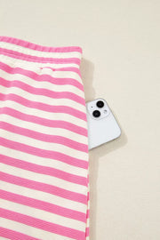 Pink and white striped cotton bikini bottoms with a phone in the pocket.