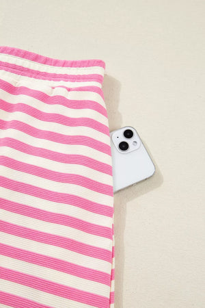 Pink and white striped cotton bikini bottoms with a phone in the pocket.